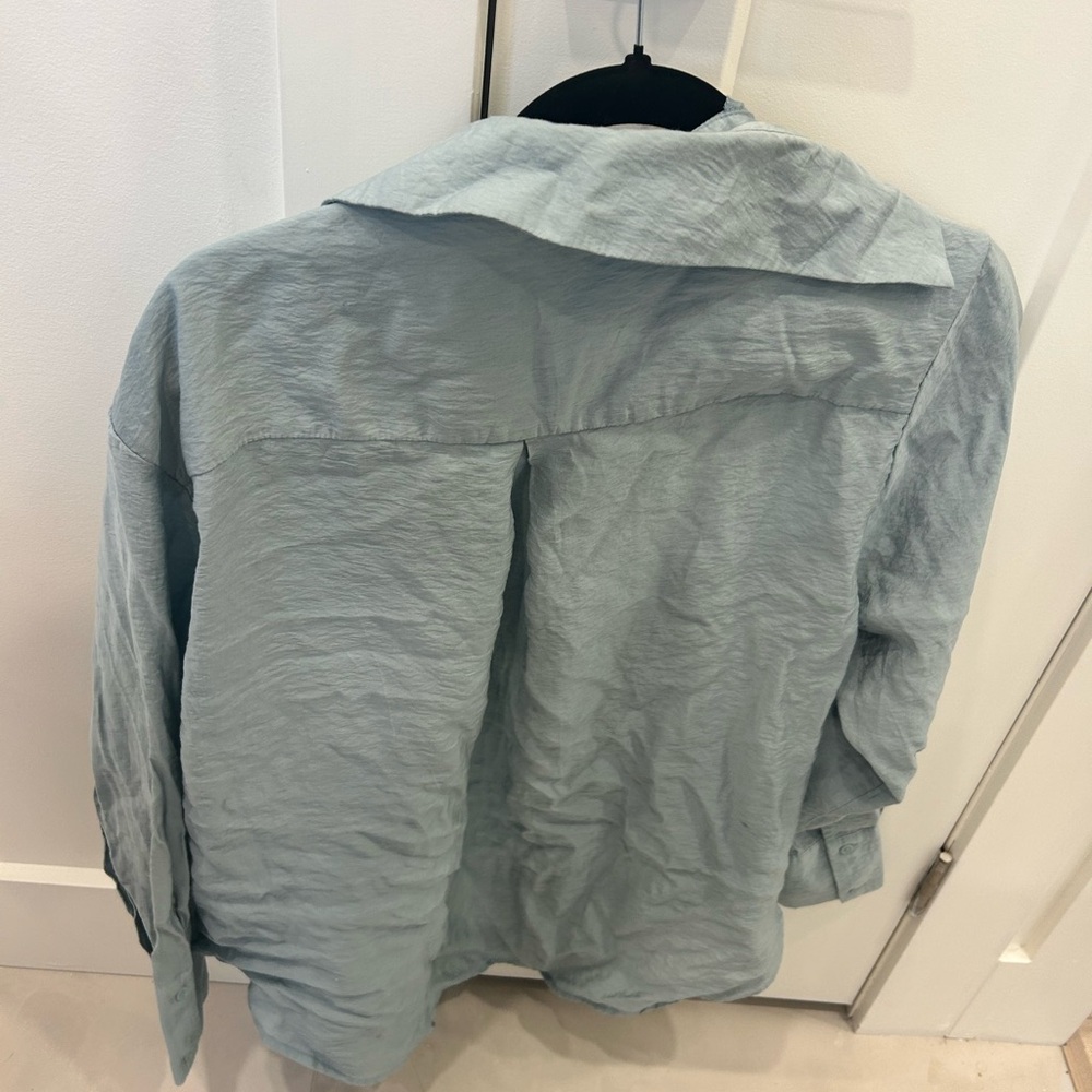 Women's Light Blue blouse. Meant to look wrinkled. Baggy.